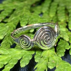 TAKE AN ADDITIONAL 20% OFF THE ALREADY REDUCED SALE PRICE - ADDITIONAL 20% IS DEDUCTED AT CHECKOUT with code SAVE20 Solid Sterling Silver A unique design with a beautiful, highly polished triple spiral with a modern twist - solid sterling silver. Choose from sizes 5-10 Irish Ring, Triple Spiral, Celtic Knot Jewelry, Celtic Spiral, Knot Jewelry, Irish Rings, Celtic Ring, Life Jewelry, Tree Of Life Jewelry