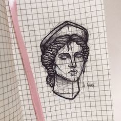 a drawing of a woman's head on a piece of paper