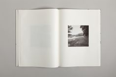 an open book with black and white photographs