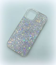 a phone case with lots of glitter on it