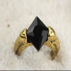 Brand New Harry Potter And The Deathly Hallows Resurrection Stone Ring Resurrection Stone, The Deathly Hallows, Harry Potter Jewelry, Deathly Hallows, Ring Color, Warner Bros, Stone Ring, Womens Jewelry Rings, Gold Black