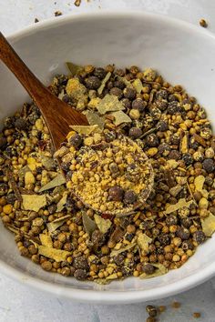 a wooden spoon in a bowl filled with cereal and other things to make it look like something out of the book