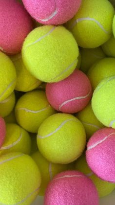 a pile of tennis balls sitting on top of each other