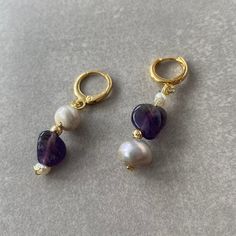 "These design hoop earrings are made of pearl and Amethyst. The combination of these two stones perfectly fits both your daily clothes and your special days. Both pearl and amethyst are stones of trust and love. The inner glow of pearls is thought to tap inner wisdom and nurture love. Pearls are also believed to signify innocence and faith.  Amethysts  promotes internal balance and harmony and brings stability to the individual. Amethysts are capable of raising ones spirits, promoting self assurance and confidence. ☆ Those looking for earrings with different designs, those who love natural stone and pearl together, and those who associate purple and white will prefer this earring! ☆ Each of the stones we use to create earrings were formed by nature over years. Each one is unique and beauti Purple Bead Earrings, Pearl And Amethyst, Inner Glow, Daily Clothes, Inner Wisdom, Small Hoop Earrings, Raw Amethyst, Earrings Bohemian, Pearl Design