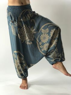 "These super soft rayon baggy unisex harem pants have the \"flow\", perfect of yoga or just a cool strolling. Comfort and character are what these pants are all about. They have the traditional sarong look & feel but a lot more practical when it comes to activity like yoga. As a bonus, they are convertible! Just pull them up and you get yourself a cute jumpsuit in a flash. Together with elastic cuff legs, you can wear them short or long. The pants have smock waist (wide bang elastic) with no Faerie Clothes, Character Appearance, Samurai Pants, Cotton Pants Women, Yoga Wear Women, Bra Sewing Pattern, Cute Jumpsuit, Indigo Design, Yoga Trousers