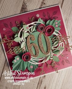 a close up of a greeting card with the number 60 on it and some flowers