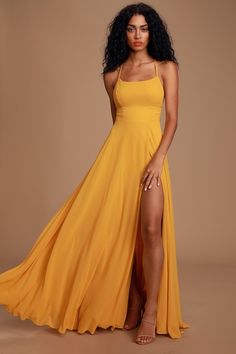 Bring your fantasy to life in the Lulus Dreamy Romance Mustard Yellow Backless Maxi Dress! Gauzy woven chiffon sweeps across an apron neckline and into a darted bodice with a figure-flattering set-in waist. Adjustable spaghetti straps crisscross over an alluring open back, while a wrapping maxi skirt with sexy side slit cascades below. Hidden back zipper/clasp. Fit: This garment fits true to size. Length: Floor length. Size medium measures 55" from adjustable straps to hem. Bust: Works best for Fitted Backless Chiffon Dress, Fitted Backless Chiffon Maxi Dress, Fitted Maxi Length Chiffon Prom Dress, Fitted Chiffon Maxi Dress For Prom, Fitted Yellow Maxi Dress With Tie Back, Yellow Chiffon Prom Dress, Chiffon Prom Dress With Tie Back, Chiffon Tie-back Dress For Prom, Chiffon Tie Back Dress For Prom