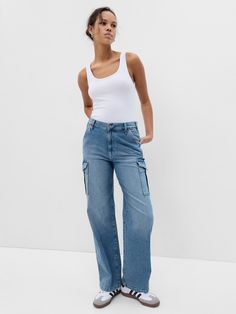 Fit: A full-length loose jean that's fitted on the waist & relaxed all the way down.  Fabric: 99% Organic Cotton, 1% Stretch.  Stretch: Low Stretch Jeans.  Authentic denim with a soft & easy lived-in feel. ​ Rise: Mid Rise Jeans.  Look: A five-pocket jean in a light indigo wash.  Details: Zip fly, five-pocket styling & cargo pockets at sides.  Responsibly Made: This pair of jeans is part of our water-saving Washwell program.  Compared to conventional wash methods, Washwell has saved millions of Cargo Jeans Outfit, Gap Jeans Women, Jeans Look, Jeans Cargo, Jean Trends, Denim Trends, Loose Jeans, Cargo Jeans, Gap Jeans