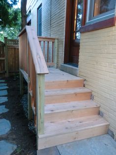 wooden steps leading to the front door of a house