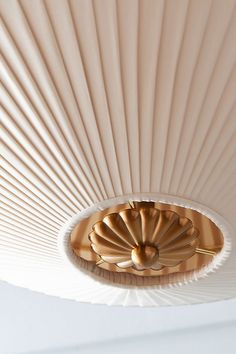 a close up of a light fixture on a ceiling