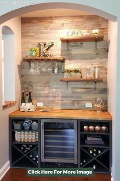 a wine cellar built into the side of a wall with shelves and bottles on it