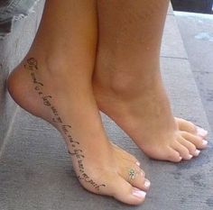 a woman's foot with words written on it