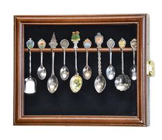 a wooden frame with spoons hanging from it