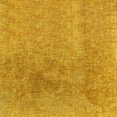 an old yellow cloth textured with some sort of stain on the fabric, as well as other material