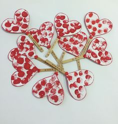 a bunch of hearts that have been cut out to look like they are being used as valentine's day crafts