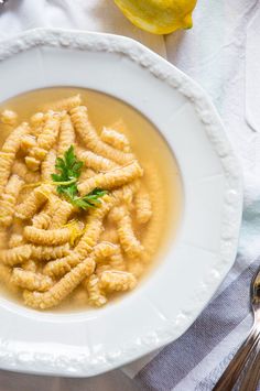 a white plate topped with pasta and sauce