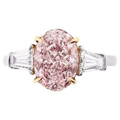 From SCARSELLI, a world-renowned fancy color diamond house, this rare 2+ Fancy Purple-pink Oval diamond is VVS1 clarity and is flanked with side white diamond baguettes in Platinum for a classic look anyone would love (see certificate information for detailed stone information) This ring may be sized or re-designed with Scarselli to suit the client's specifications Other Fancy Pink diamonds are available to discuss upon inquiry. Should a client wish to customize settings to personalize the look, Diamond House, Royal Ring, Baguette Side Stones, Engagement Ring Types, Colored Diamond Jewelry, Yellow Diamonds Engagement, Expensive Diamond, Pink Diamond Ring, Contemporary Engagement Rings