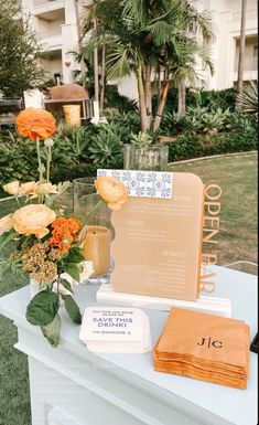 a table with flowers and menus on it