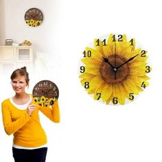 a woman holding up a clock with a sunflower on it