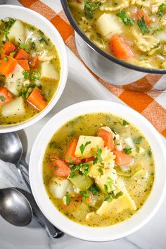 two bowls filled with soup on top of a table