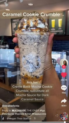 someone holding up a cup with food in it and the caption reads caramel cookie crumble