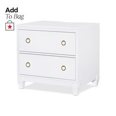 a white nightstand with two drawers on each side and an ad to bag above it