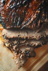 the meat has been sliced and is ready to be eaten on the cutting board,