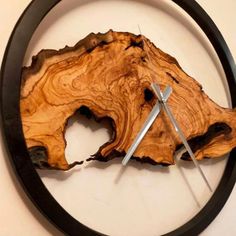 a clock made out of a piece of wood