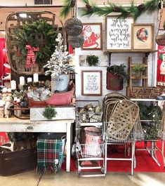 a room filled with lots of christmas decorations and decor on the walls, including chairs