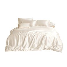 a bed with white sheets and pillows on it