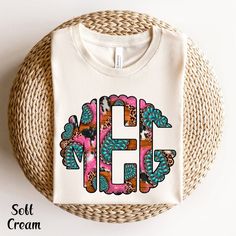 Western Shirt Vintage Monogram Personalization Initial Shirt Cow Shirt For Women Circle Monogram Shirt Western T Shirt Custom Monogram Custom Gift Shirt ✨ PRODUCT DESCRIPTION ✨  This monogram short-sleeve tee fits like a well-loved favorite. Soft cotton and quality print make users fall in love with it over and over again. The shoulders have taping for a better fit over time. Dual side seams hold the garment's shape for longer. ∘ Runs true to size ∘ Heat transfer label ∘ Solid colors: 100% Preshrunk Cotton ∘ Heather Colors: 52% Cotton / 48% Poly ∘ Design colors may differ slightly from the final printed item due to the printing process and monitor calibration. 📏 SIZE 📏 ∘  Adult Unisex sizing. We have a size chart on our listing photos ↑. ✨ ORDER INSTRUCTIONS✨ ∘  In the personalization bo Cotton Monogram Print Graphic Tee, White Monogram Crew Neck T-shirt, Pink Monogrammed Crew Neck Top, Pink Monogram Crew Neck Top, Pink Crew Neck Top With Monogram, White Monogram T-shirt With Crew Neck, White Monogrammed Short Sleeve Top, White Monogram Crew Neck Top, White Monogram Short Sleeve Top