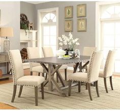 a dining room table with chairs around it