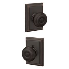 an image of two knobs on the side of a wall mounted light switch in bronze