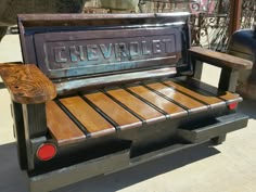 an old chevrolet truck has been restored into a bench