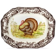 an ornately decorated platter with a turkey on the front and sides, painted in brown