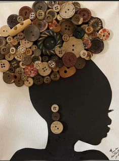 a woman's head made out of buttons with the shape of a person's head