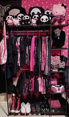 a closet filled with lots of pink and black items