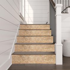 the stairs are decorated with gold and white designs