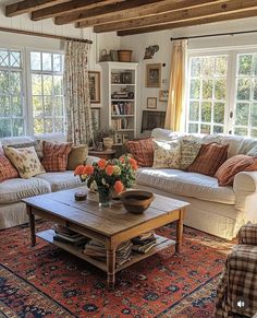 a living room filled with furniture and lots of windows