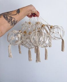 a person is holding some kind of chandelier