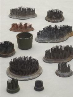 a bunch of hair brushes sitting on top of each other