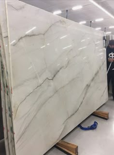 a large white marble slab being worked on