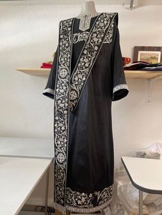 Orthodox deacon vestments set. Fully embroidered, made from silk. It includes stikharion, cuffs and orarion. After the order we will ask your measurements. It takes about four week to produce it and ship to you. We locate in FL, USA. Traditional Black Agbada For Ceremonies, Traditional Black Embroidered Thobe, Black Traditional Wear With Embroidered Border For Ceremonial Occasion, Ceremonial Black Kurta With Gold Embroidery, Black Kurta With Gold Embroidery For Ceremonial Occasions, Elegant Black Agbada For Wedding, Black Silk Traditional Wear For Ceremonial Occasions, Traditional Silk Abaya, Ceremonial Black Kurta With Traditional Patterns