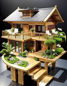 a wooden house with plants and rocks on the ground