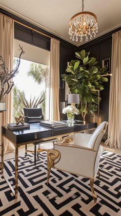 a black and white room with a chandelier hanging from the ceiling next to a large window