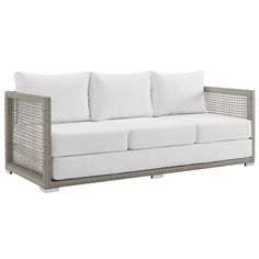 an outdoor sofa with white cushions and pillows on the back, in front of a white background