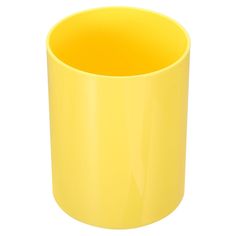 a yellow cup sitting on top of a white table