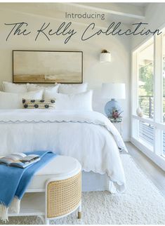 a bedroom with white bedding and blue accessories on the headboard is featured in this article