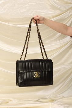 CONDITION: GOOD VINTAGE .?ÿ A?ÿChanel gem crafted in buttery soft lambskin with vertical quilting, and 24K gold plated hardware. It's a spacious bag with lots of room, and features the extra large turnlock logo. Currently going for $6k-$7k! Crafted in 1994-1996. Please note:?ÿMinor creasing on exterior leather, and slight rubbing on corners. Hardware in beautiful yellow gold! In order to meet the current demand and given the?ÿnature of sourcing inventory, all sales are final. Please be sure to review all pictures and ask any questions prior to making a purchase! To prevent any form of fraud, I?ÿkeep video records of?ÿmyself?ÿpackaging?ÿand dropping off each order, and?ÿall?ÿorders ship with?ÿtracking and?ÿsignature?ÿconfirmation. Please ensure your shipping address is correct as we are not Gem Crafts, Girl Backpacks School, Bottega Veneta Shoulder Bag, Handbag Wallet, Dior Shoes, Louis Vuitton Shoes, Wallet Accessories, Girl Backpacks, Bago