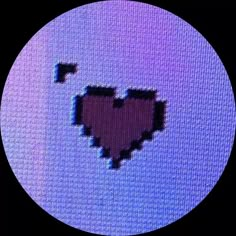 a pixeled heart is shown in the middle of a screen with purple and blue colors